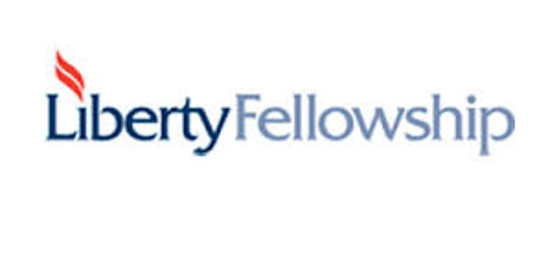 The image displays the logo for Liberty Fellowship. The word "Liberty" is in a dark blue, bold font, accompanied by a stylized red flame above the "L". The word "Fellowship" is in a lighter blue, sans-serif font. The overall design is clean and professional, suggesting an organization focused on freedom and community.